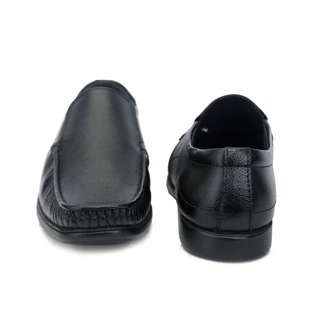 Black formal slip-on with moccasin stitching and ribbed sole: