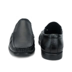 Black formal slip-on with moccasin stitching and ribbed sole: