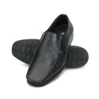 Black formal slip-on with moccasin stitching and ribbed sole: